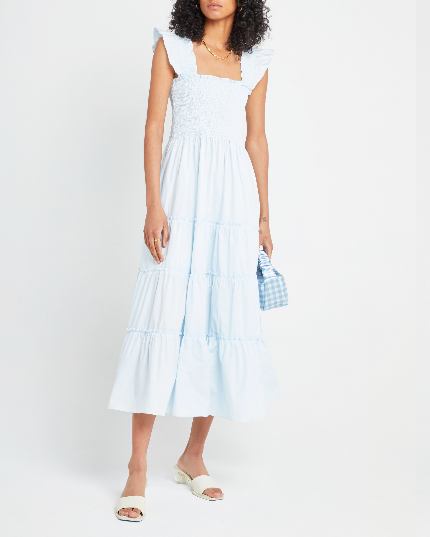 First image of Calypso Maxi Dress, a blue maxi dress, ruffle cap sleeves, smocked bodice