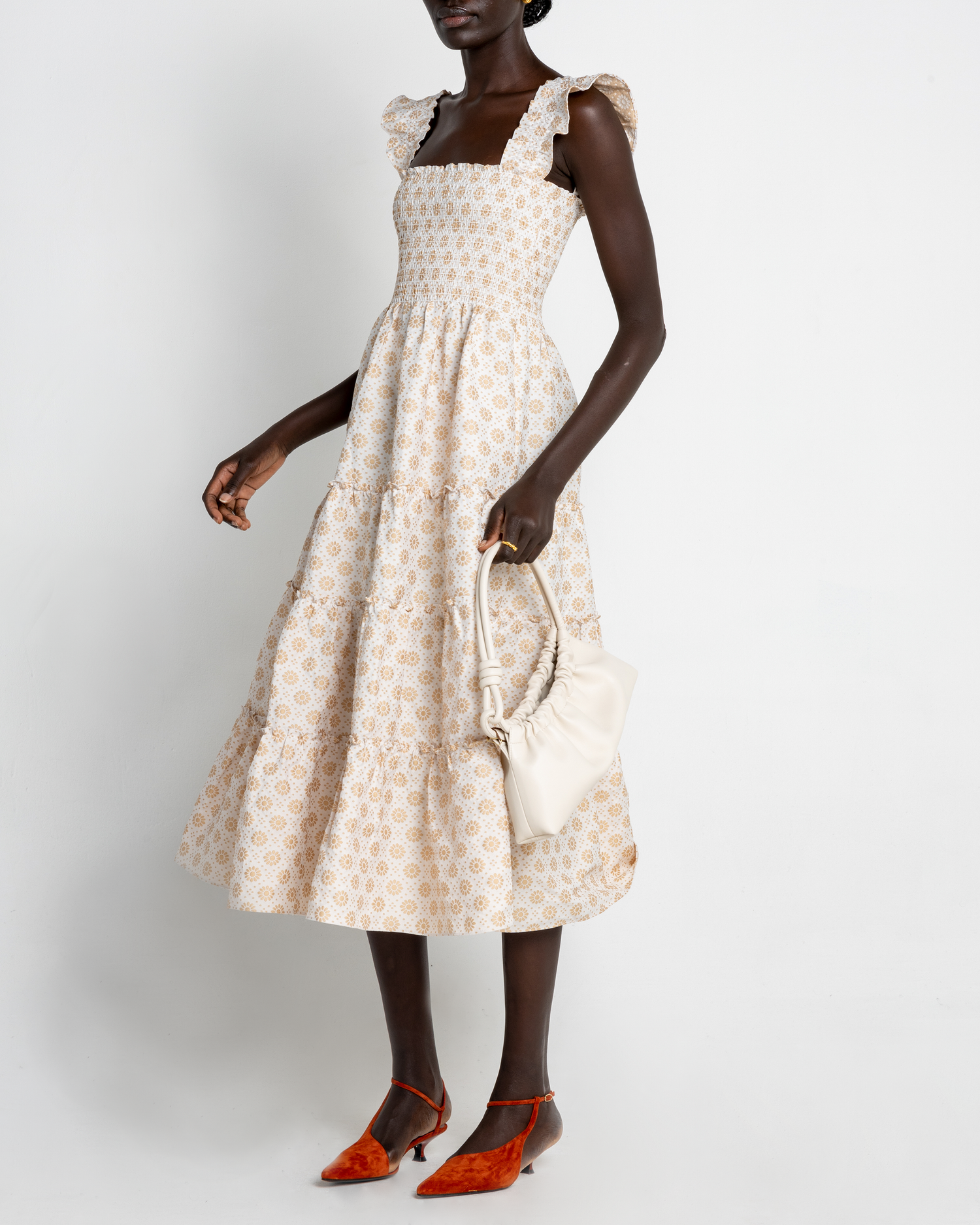 Third image of Calypso Maxi Dress, a white maxi dress, ruffle cap sleeves, smocked bodice, gold, floral