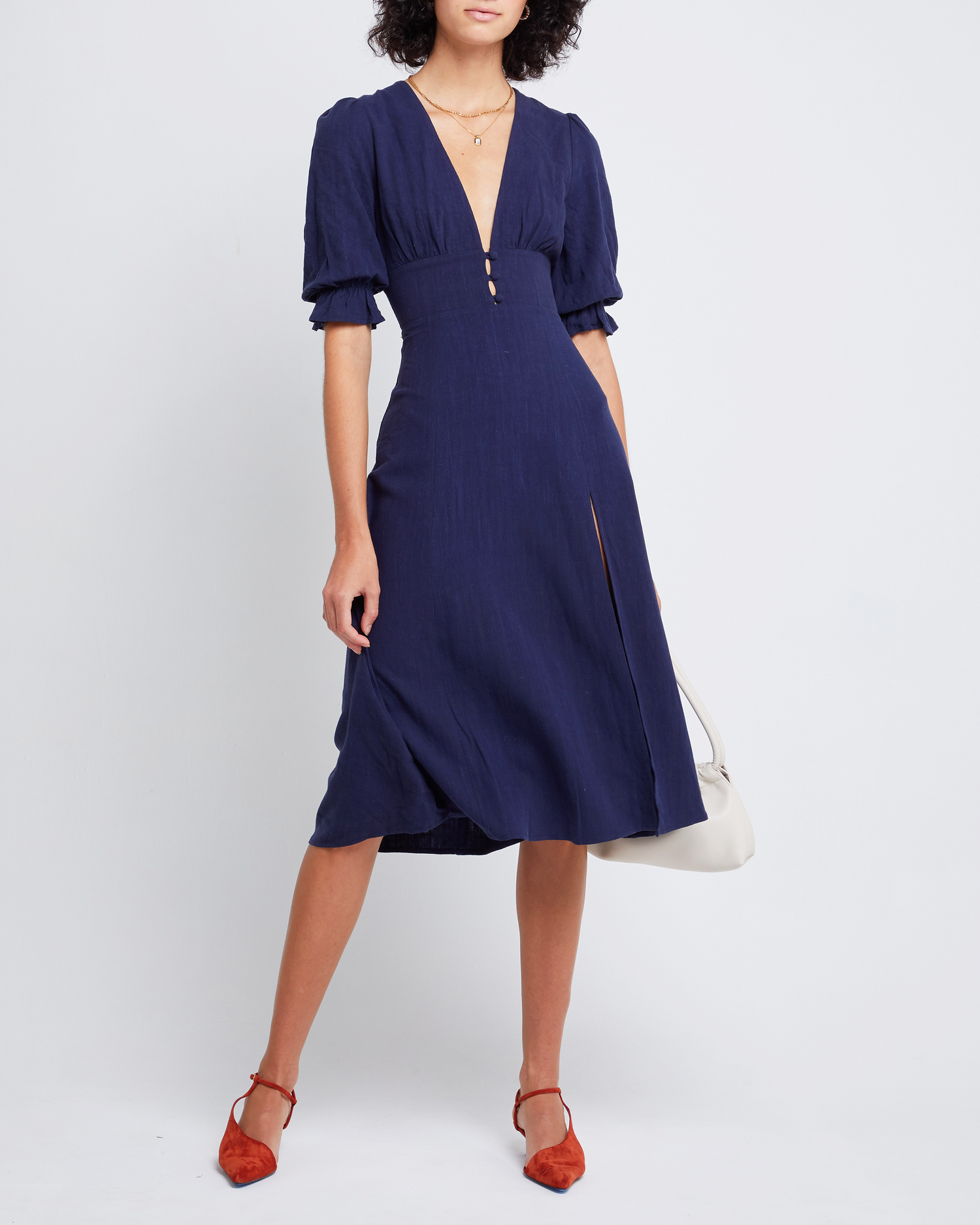 Fourth image of Julien Dress, a blue midi dress, V-neck, plunge neck, 3/4 sleeves, puff sleeves, side slit, front buttons