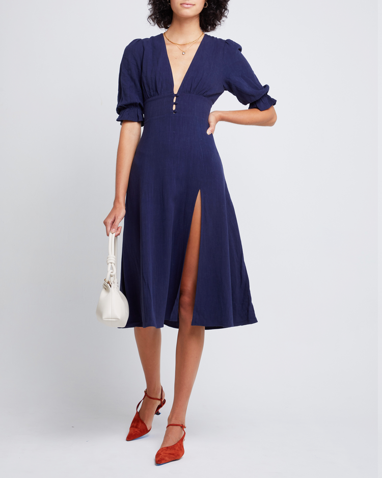 Fifth image of Julien Dress, a blue midi dress, V-neck, plunge neck, 3/4 sleeves, puff sleeves, side slit, front buttons