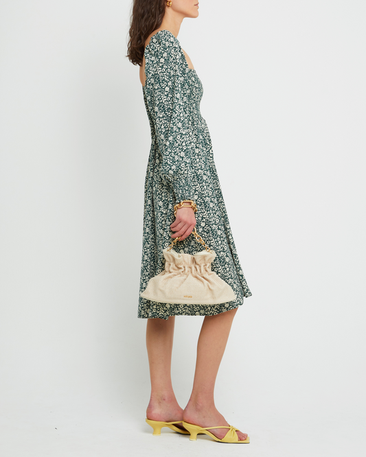 Third image of Classic Smocked Midi Dress, a green midi dress, side slit, long, sheer sleeves, puff sleeves, square neckline, smocked bodice