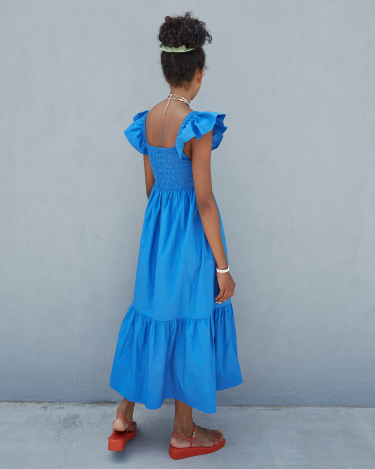 Fourth image of Tuscany Dress, a blue maxi dress, smocked bodice, ruffled cap sleeves, pockets