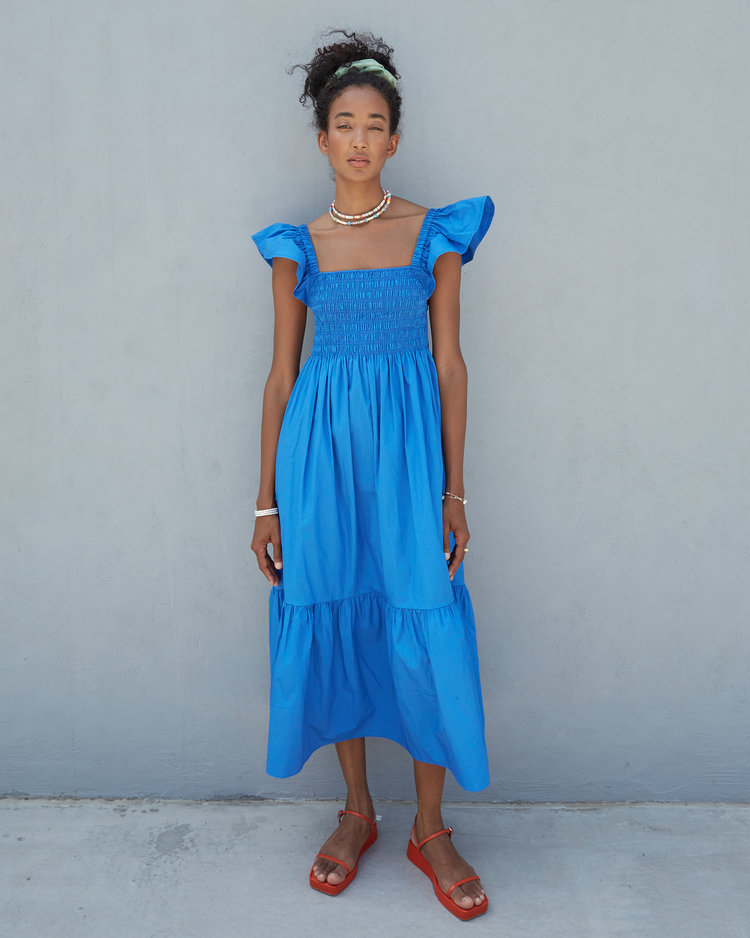 Fifth image of Tuscany Dress, a blue maxi dress, smocked bodice, ruffled cap sleeves, pockets