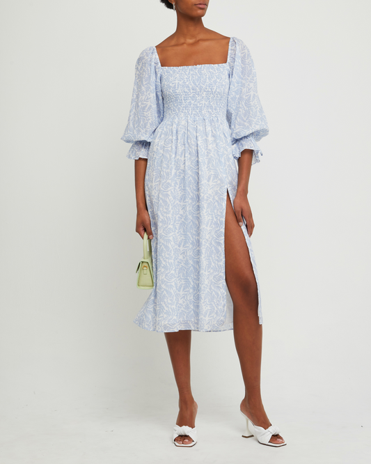 First image of Sofija Dress, a blue midi dress, side slit, square neckine, smocked, puff sleeves