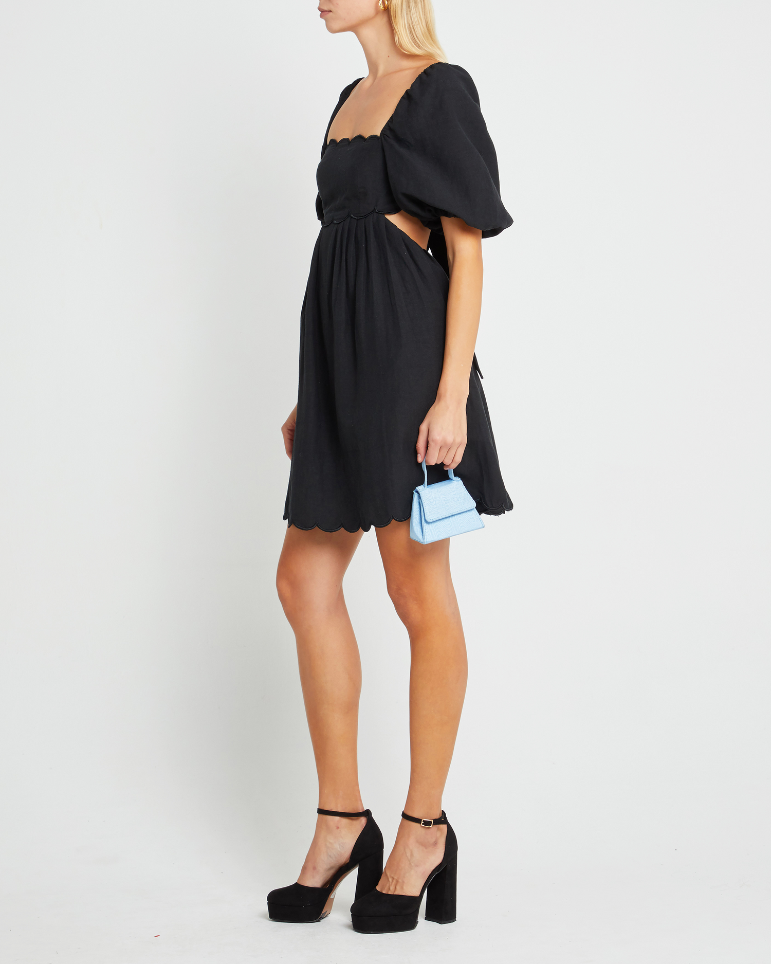 Third image of April Dress, a black mini dress, open back, tie back, short sleeve, scalloped hem